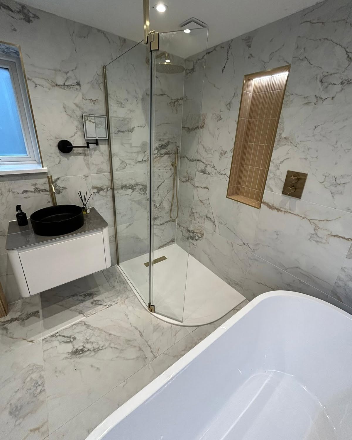 Luxury marble bathroom refit completed by Eco Plumbing & Heating Solutions in Greater Manchester